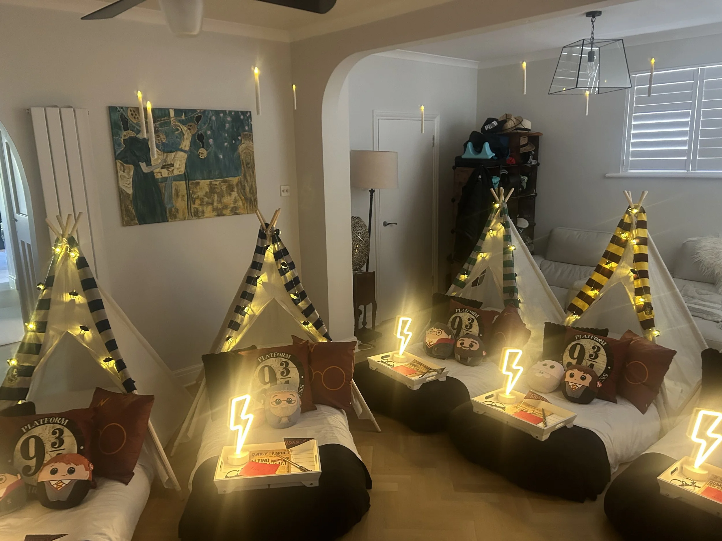 As the light fades, the lamps and floating candles take over. This is the moment the room goes quiet before the giggling starts all over again.