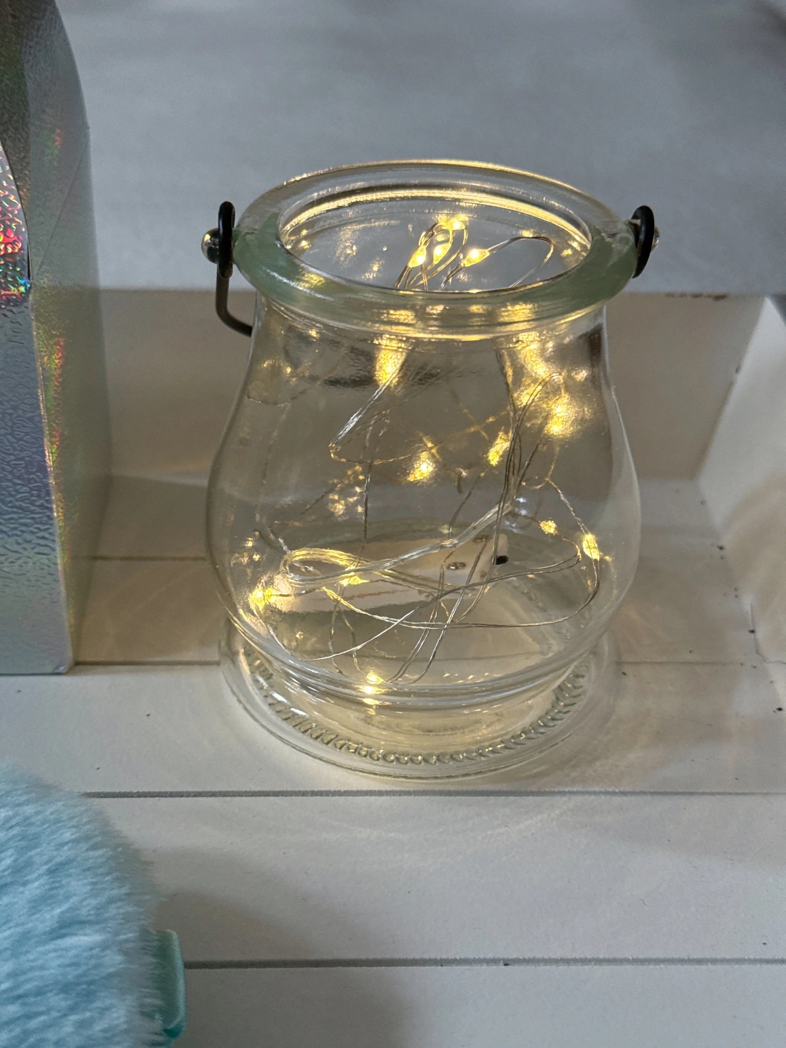 Glowing fairy light jar styling detail from a Mermaid Lagoon themed sleepover party by Sweet Dreams Events.