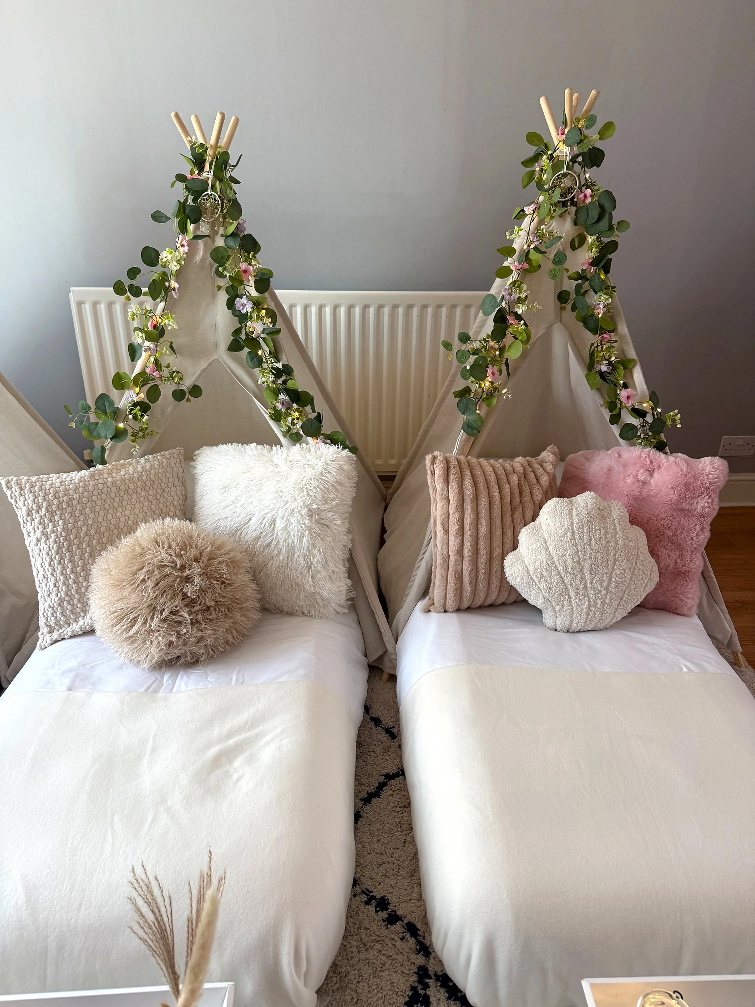 Our boho sleepover theme styled for three guests, combining soft cream tones, blush pink details and beautiful floral garlands. Each child gets their own cosy sleep space, with matching bedding and themed styling throughout.