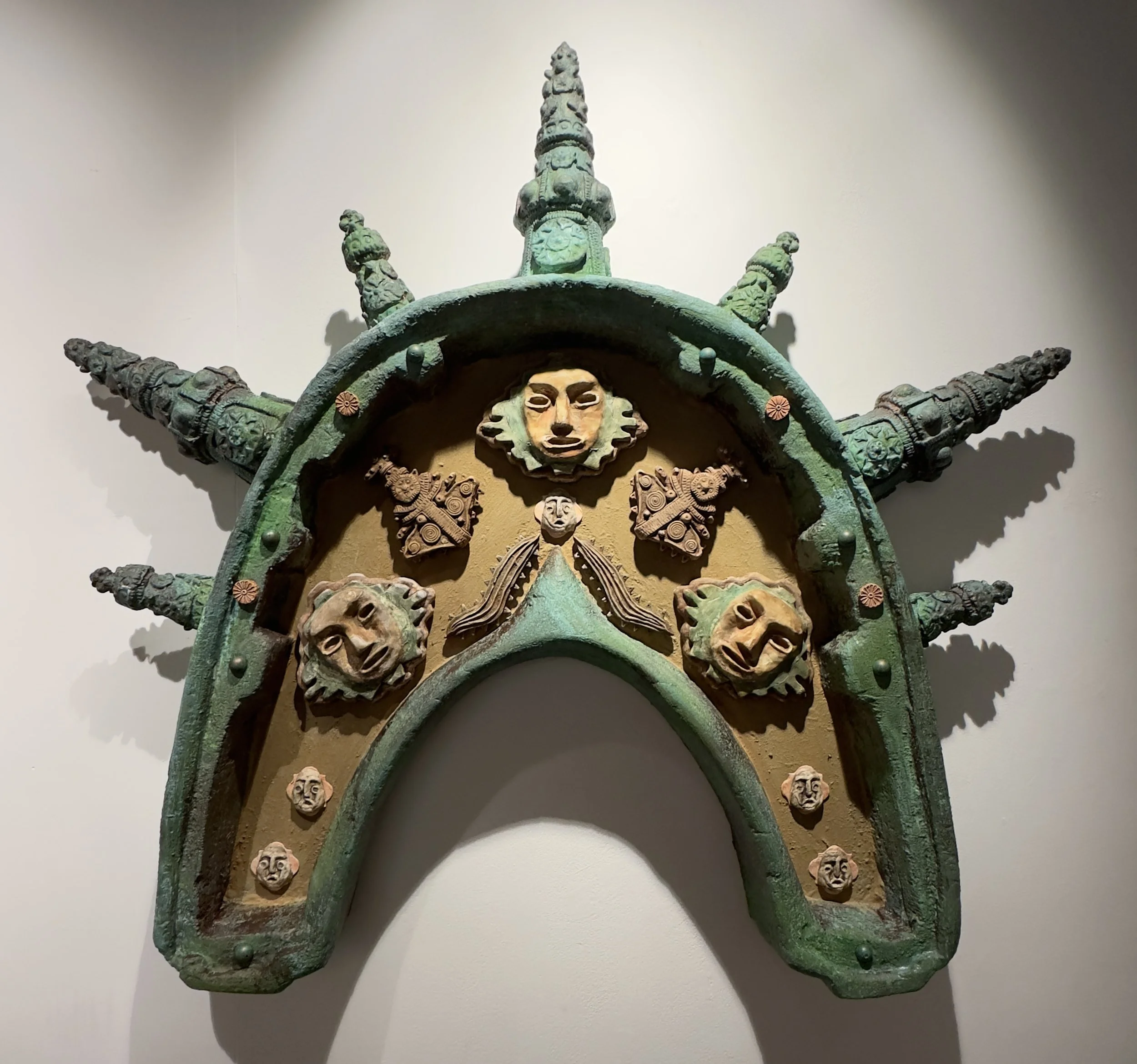 Mystery of Lineage, 2025, foam, 56 x 62 x 7 in, plaster, air dry clay, wood, and acrylic paint, inspired by pre-Columbian artifacts and architecture, this artwork represents the mystery of lineage and explores ancestral memory through a monumental fo