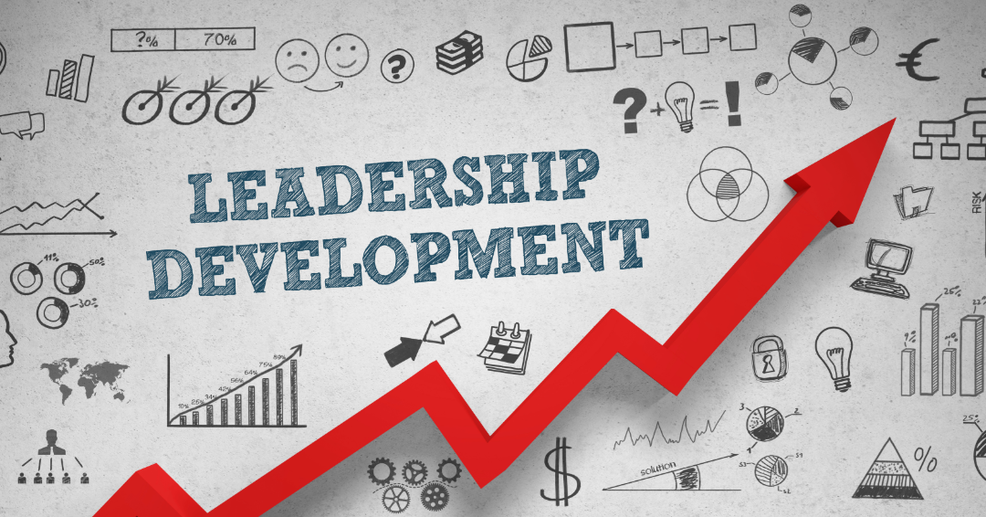 A background of business and financial sketches, graphs, charts, and symbols surrounding the words 'Leadership Development' with a red rising arrow indicating growth.