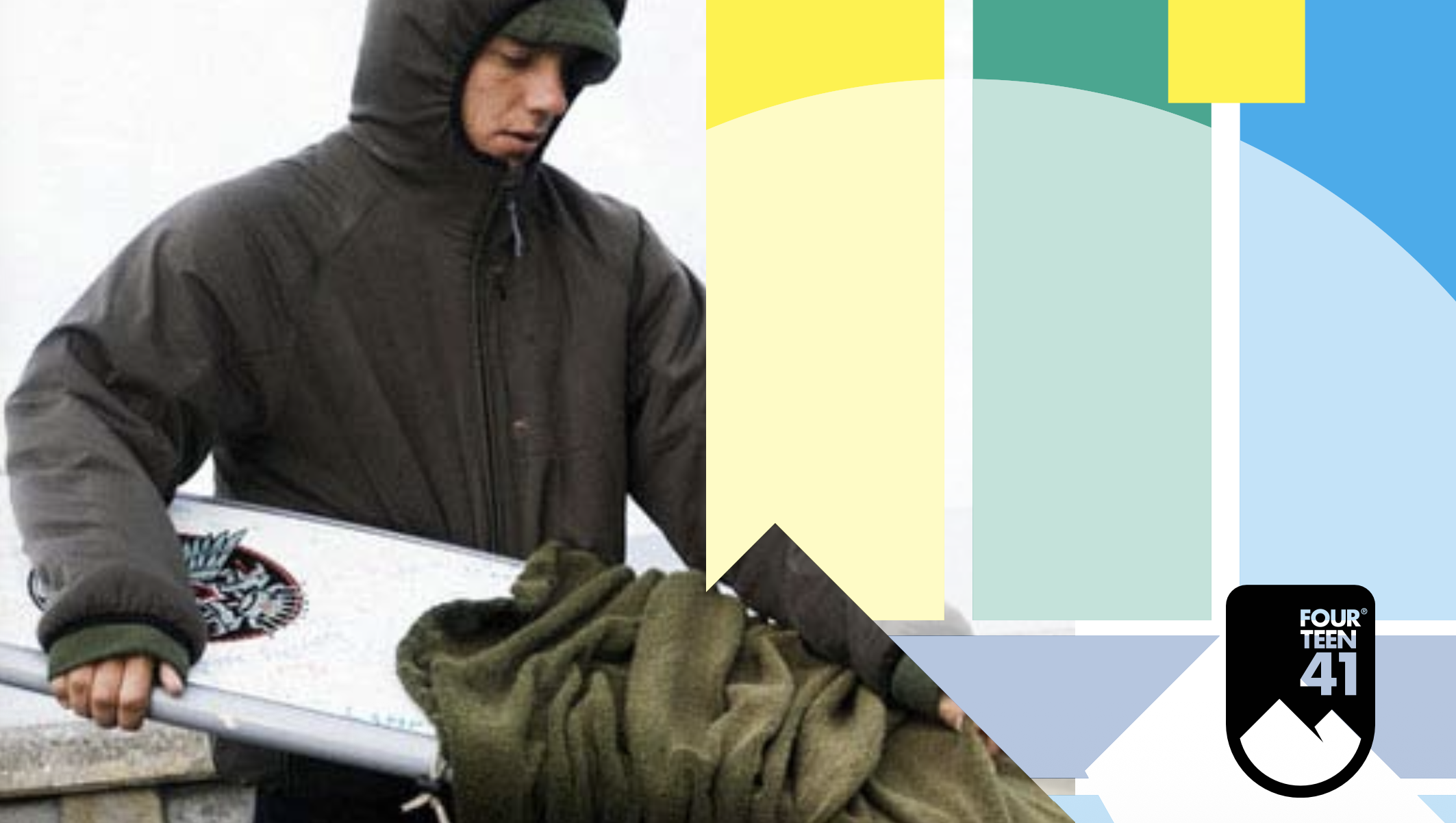 A person dressed in a dark coat and hoodie, wearing green gloves, holding a ski pole, with a snowboard nearby, against a cloudy sky.