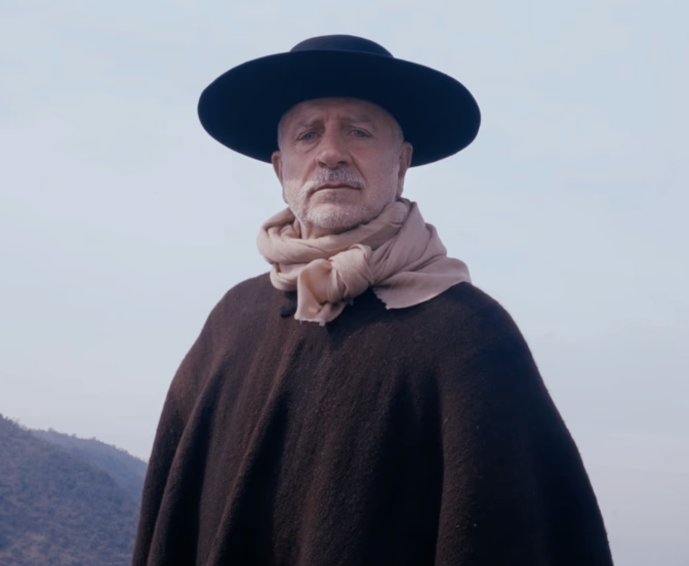 Artist Fernando Cassasempere, in his homeland, Chile, with mountains in the background.