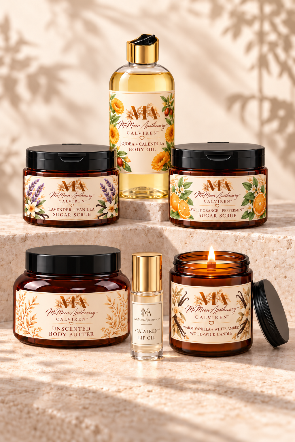 CALVIREN body oil, two sugar scrubs, body butter, lip oil and Warm Vanilla + White Amber candle arranged on stone steps.