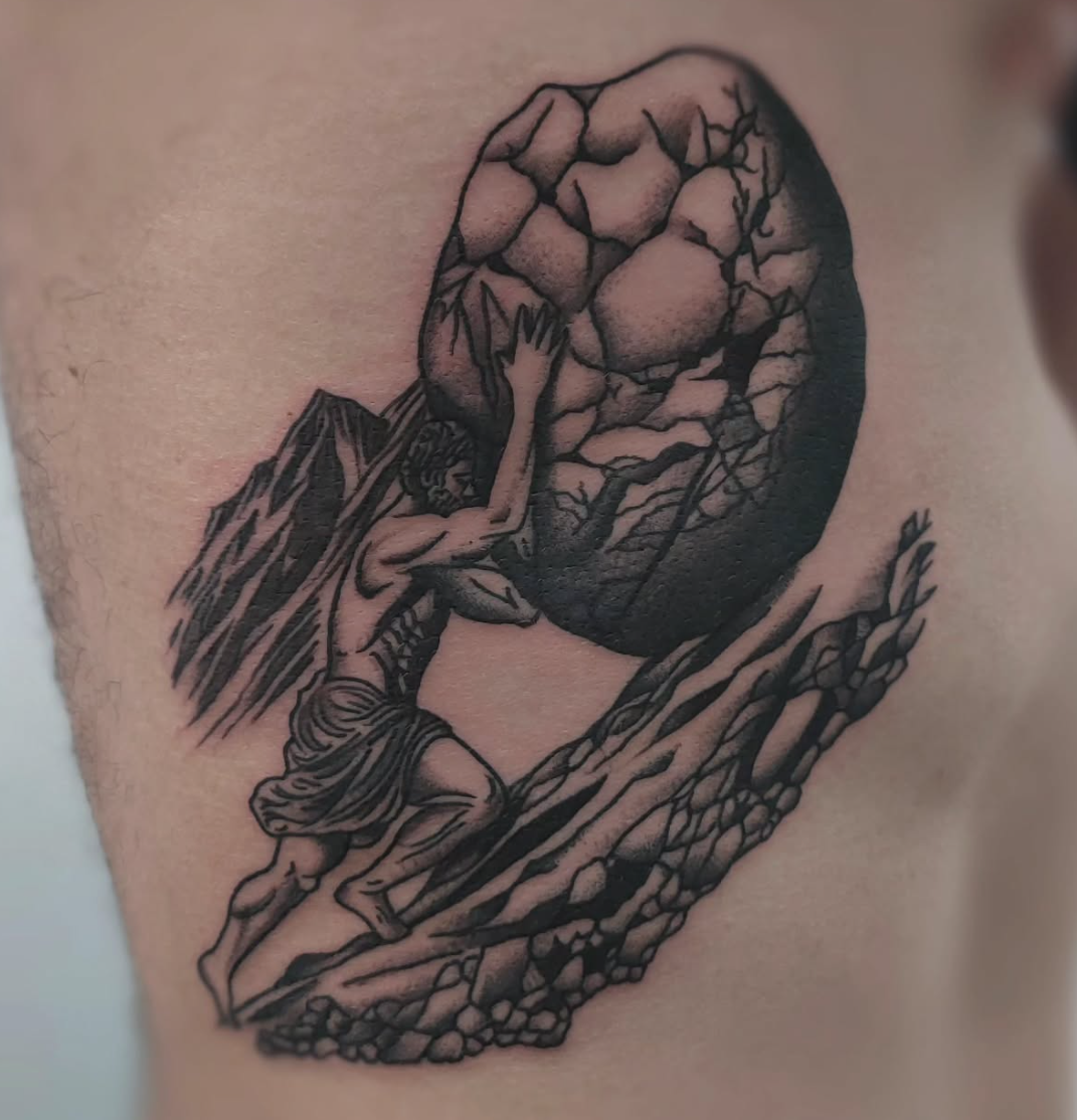A tattoo of a person pushing a large boulder up a hill, reminiscent of the myth of Sisyphus.