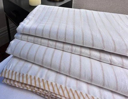 Dune folded d/canter cotton muslin blankets in neutral and pinstripe designs