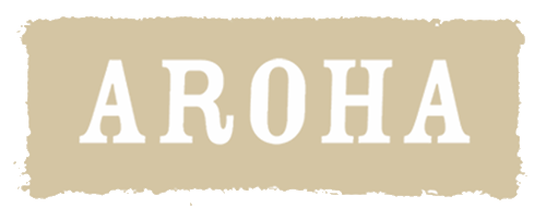 Sign with the word "Aroha" on a beige background with rough edges.