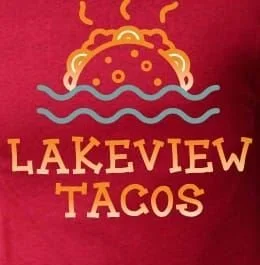A logo for Lakeview Tacos featuring a stylized taco with waves and steam, set against a red background.