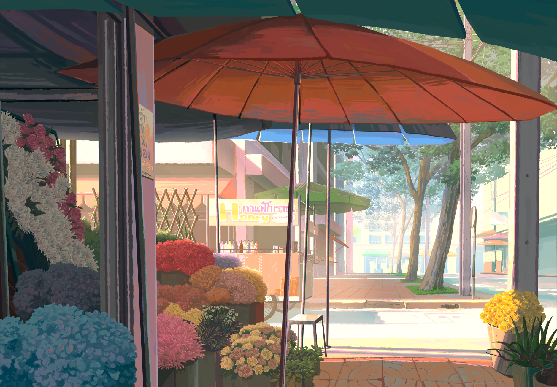 Street scene with flower shop, large umbrellas, trees, and a sidewalk.