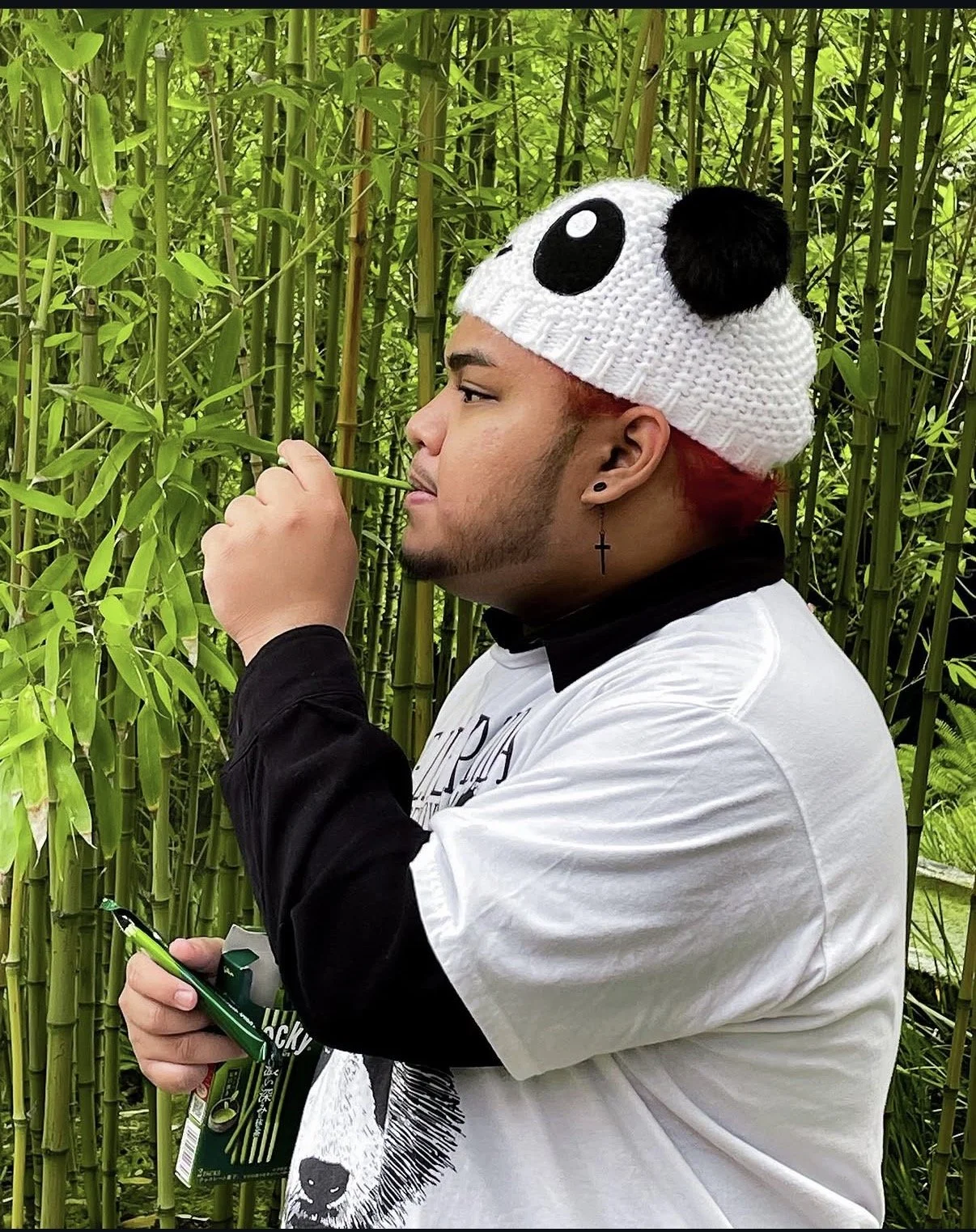 Chris Ceguerra (The Panda) snacks on matcha flavored snacks as his "bamboo."
