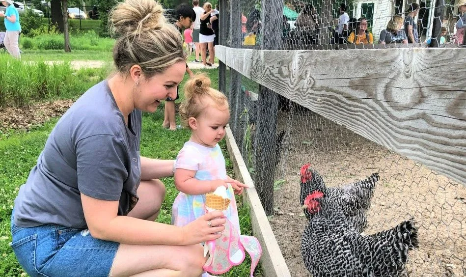 Mom and daughter with chicket