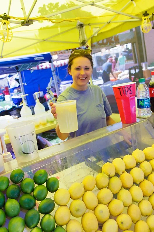 a concession stand with frozen lemonade