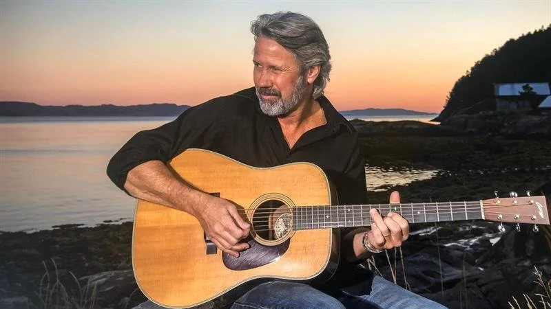 performer Jeff Porter playing the guitar