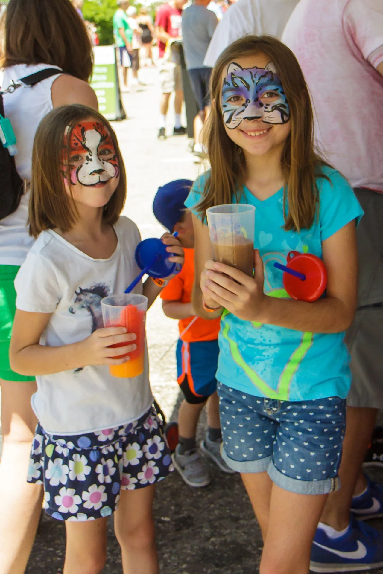 two young girls in face paint
