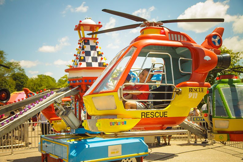 A young boy in a helicopter ride at Old Shawnee Days