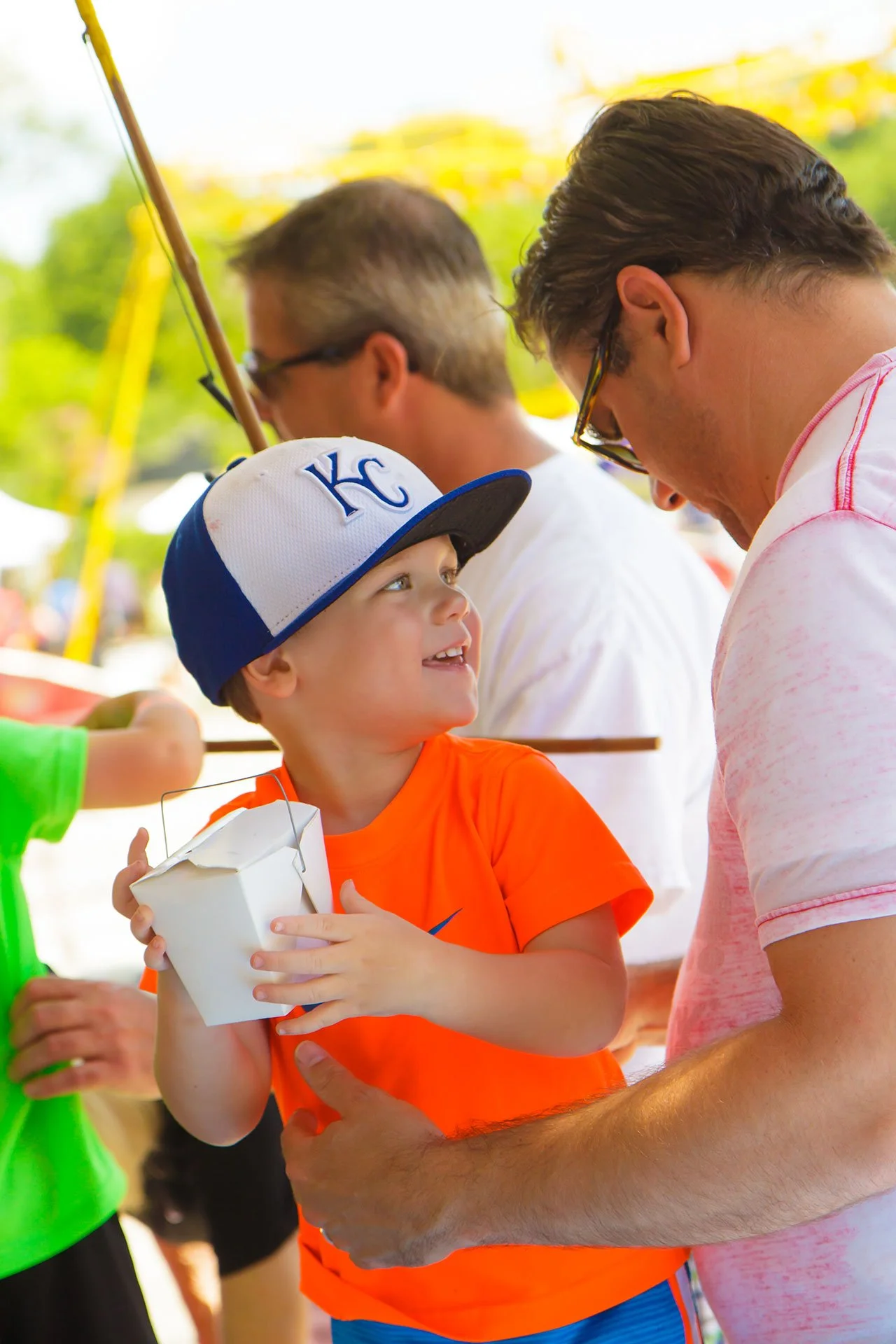 young boy in a KC Royals hat
