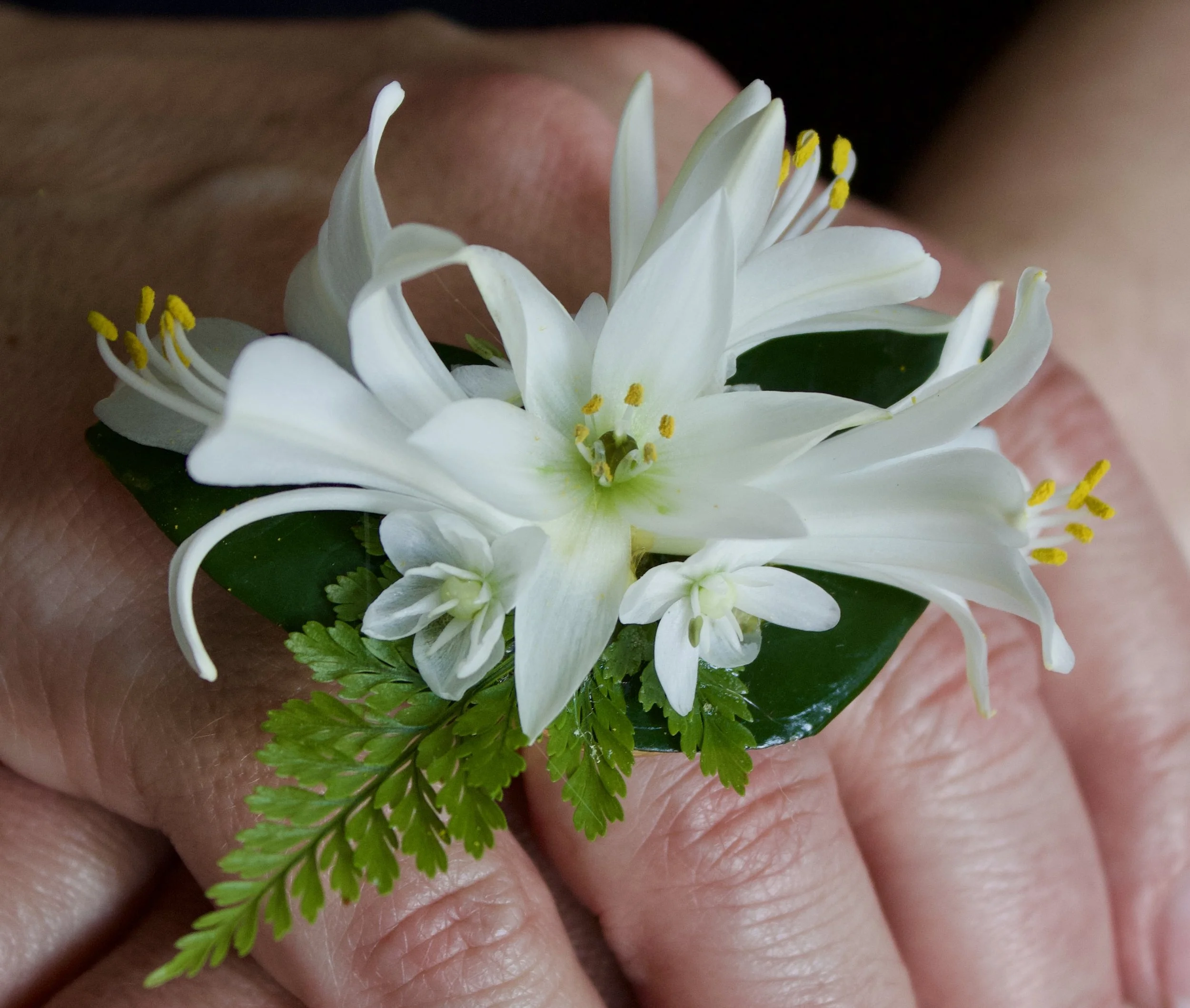 Handcrafted wearable floral ring with white blooms — bespoke floral art by Worn & Wild Florals, Calgary AB