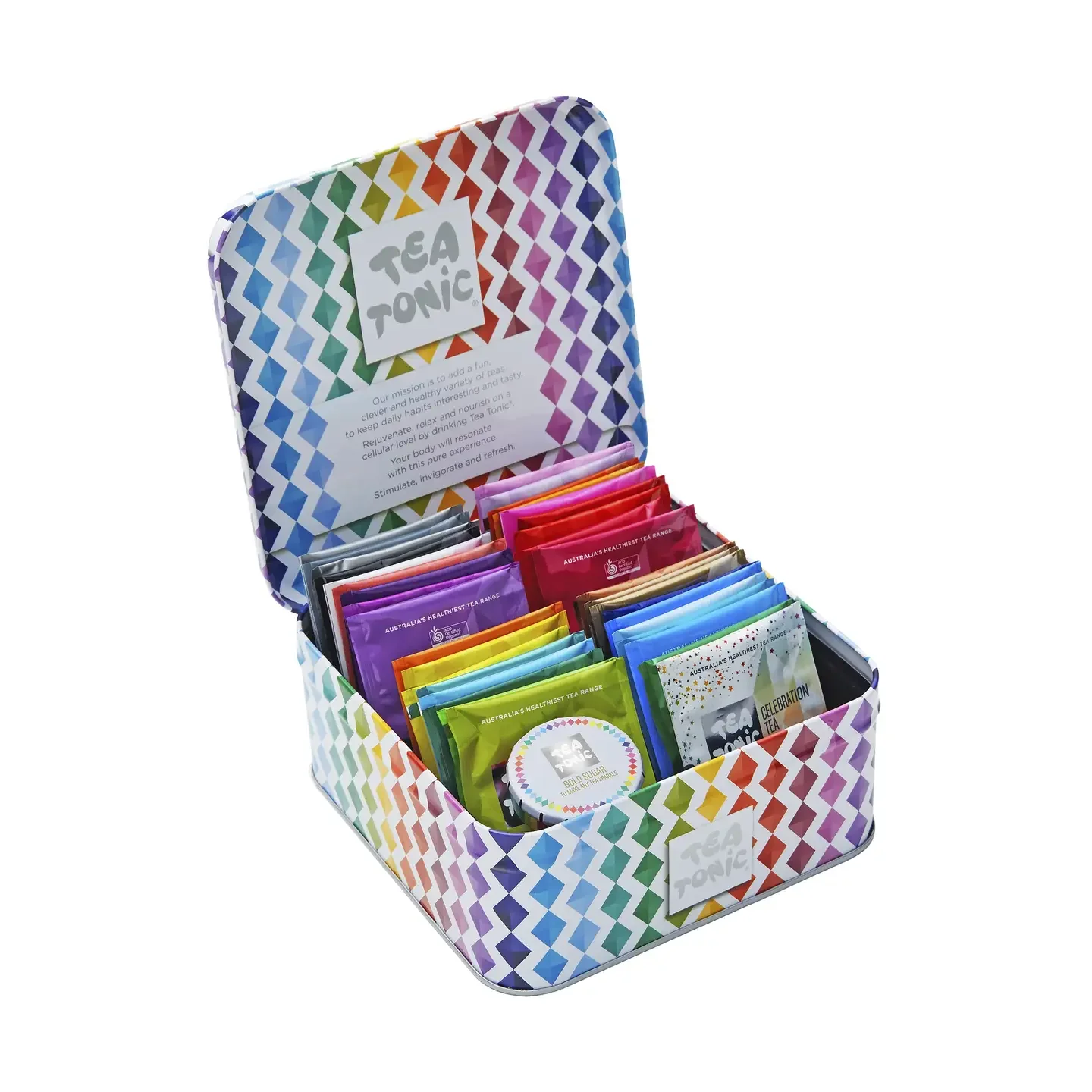 Open colorful tea box containing various tea bags and a small container of tea. The box, labeled 'Tea Tonic,' features a vibrant geometric pattern and has a printed message about the benefits of tea.