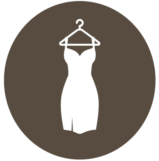 Black strapless dress hanging on a hanger against a brown background.