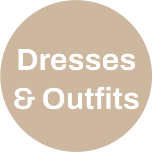 A circular sign with beige background and black text reading "Dresses & Outfits."