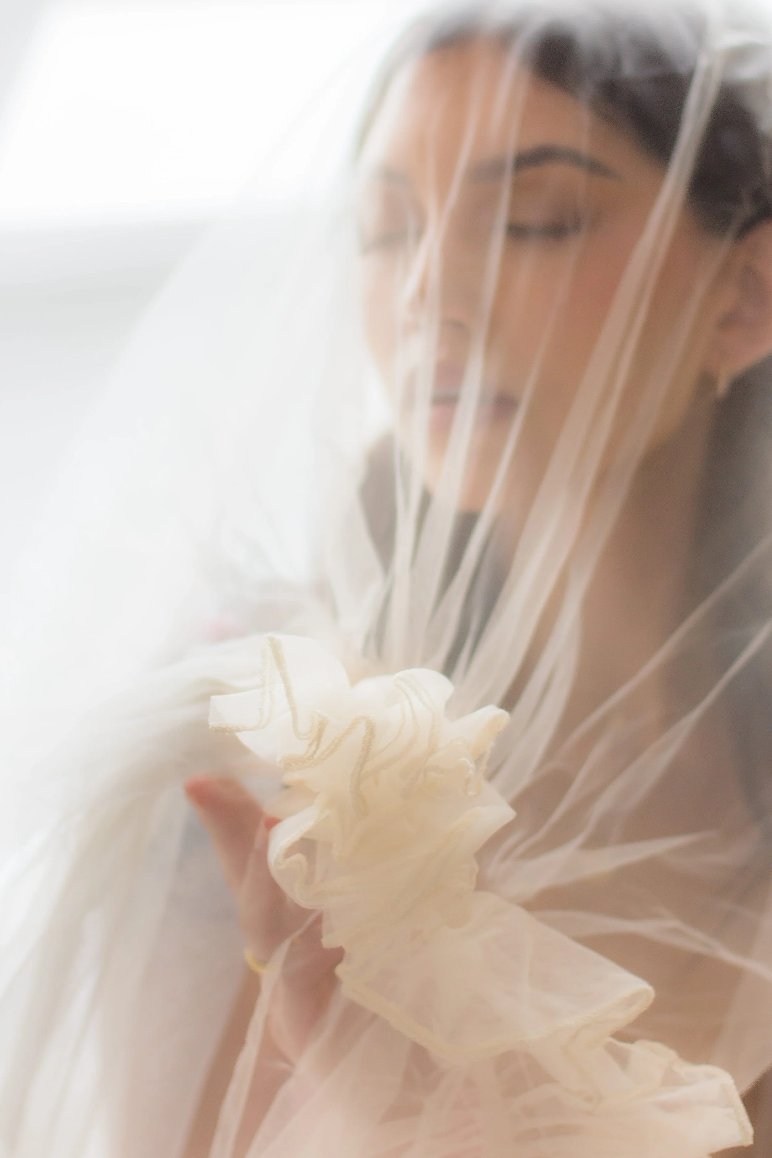 chicago bride poses for boudoir in custom veil