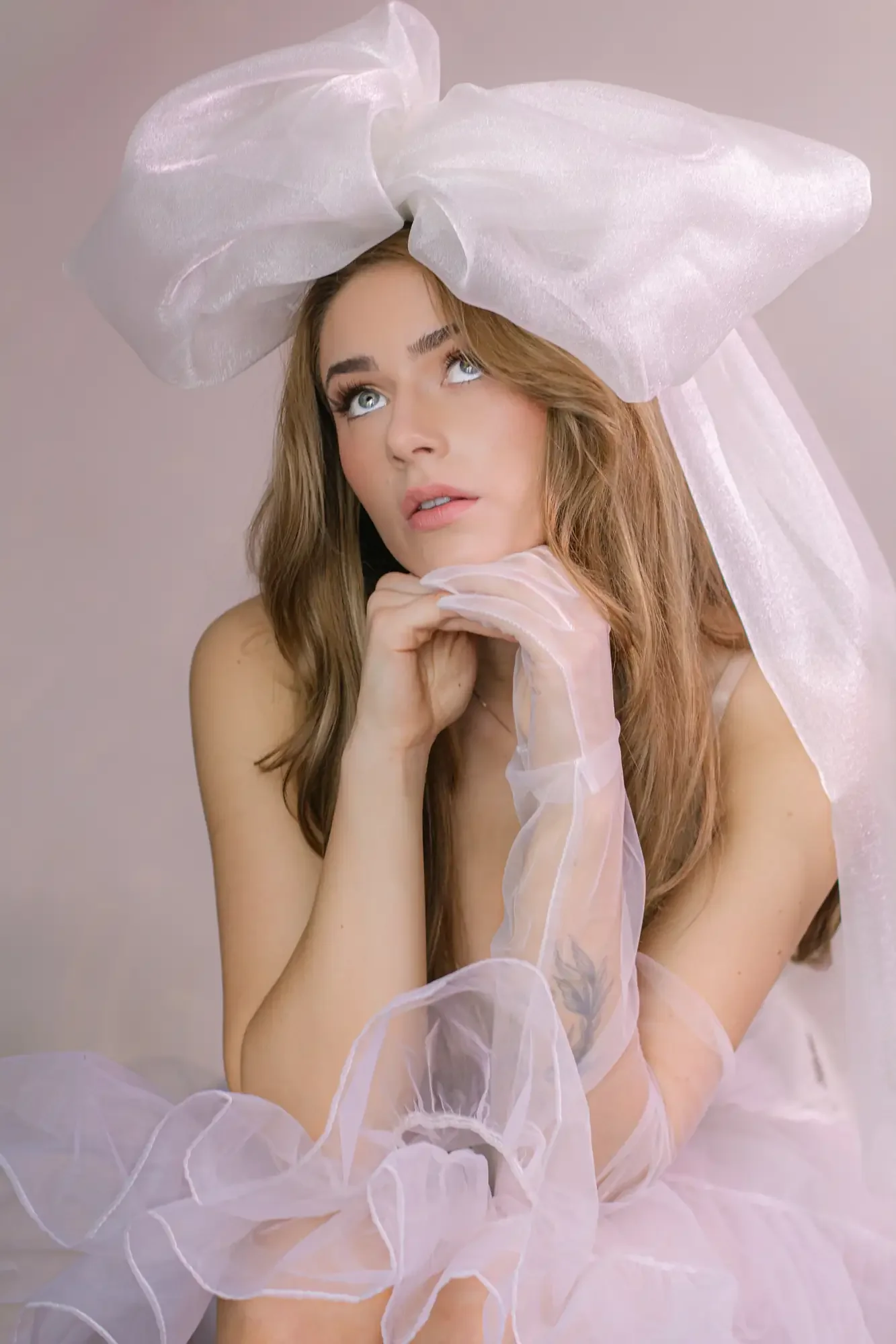 editorial moment during boudoir shoot featuring big bow