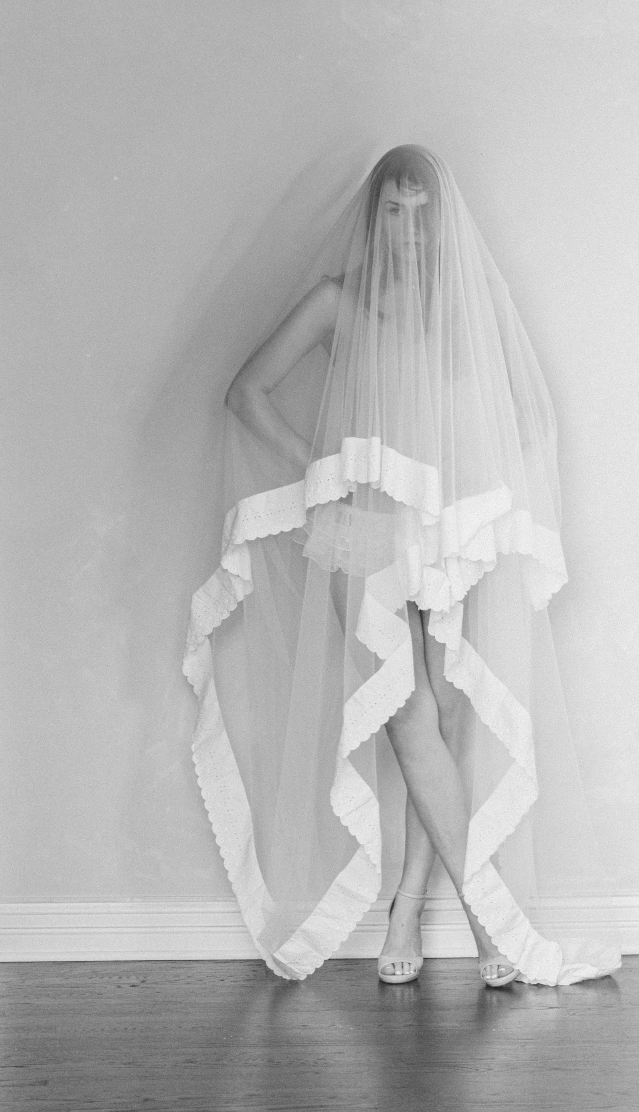 chicago bride poses in long boudoir veil