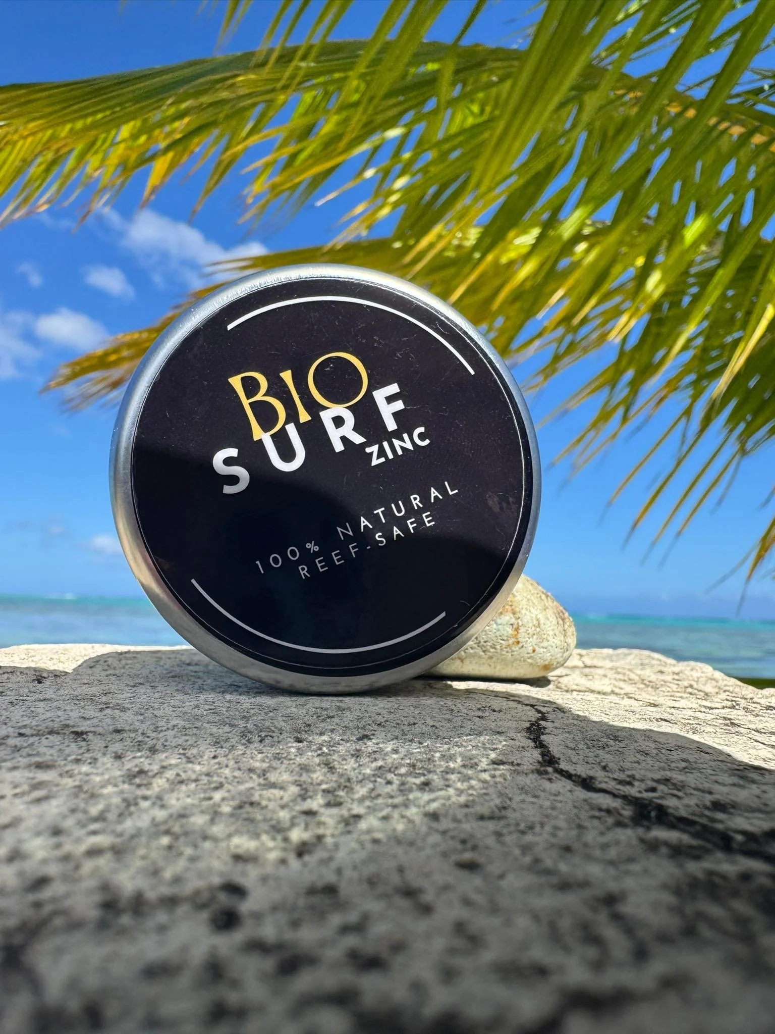 A container labeled 'Bio Surf Zinc' reef-safe, marine -safe non-nano zinc oxide- made for surfers and ocean lovers