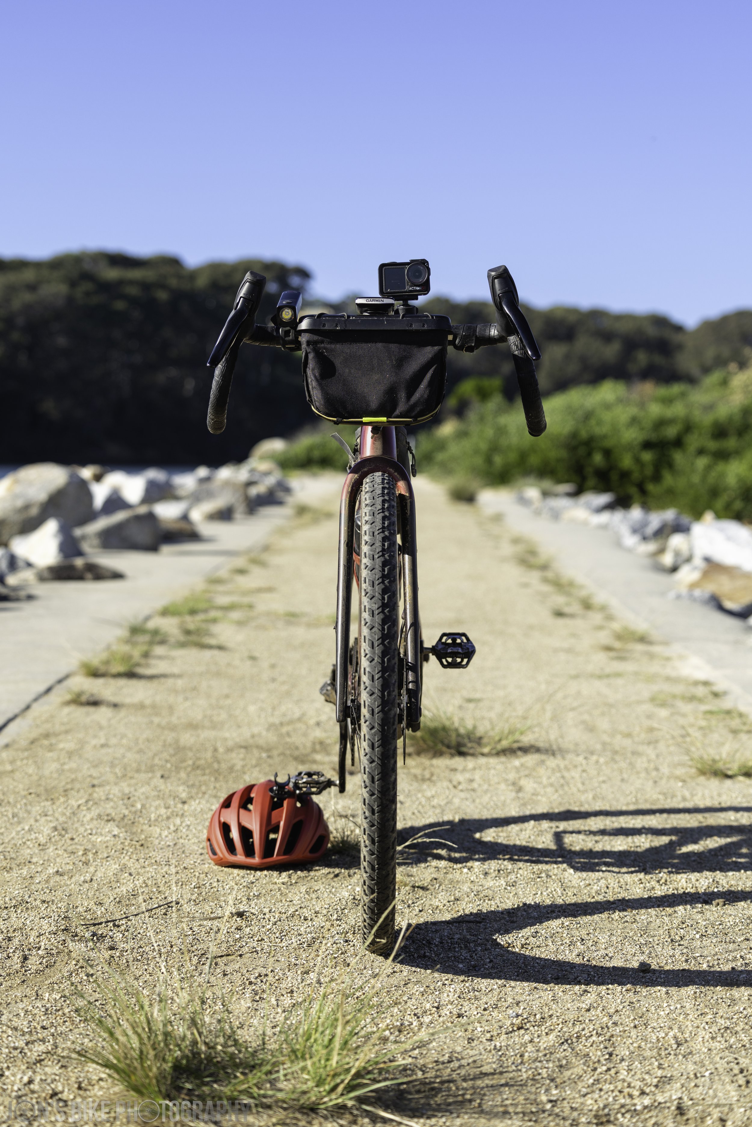 Head on shot of a red Trek Checkpoint gravel bike at Narooma.