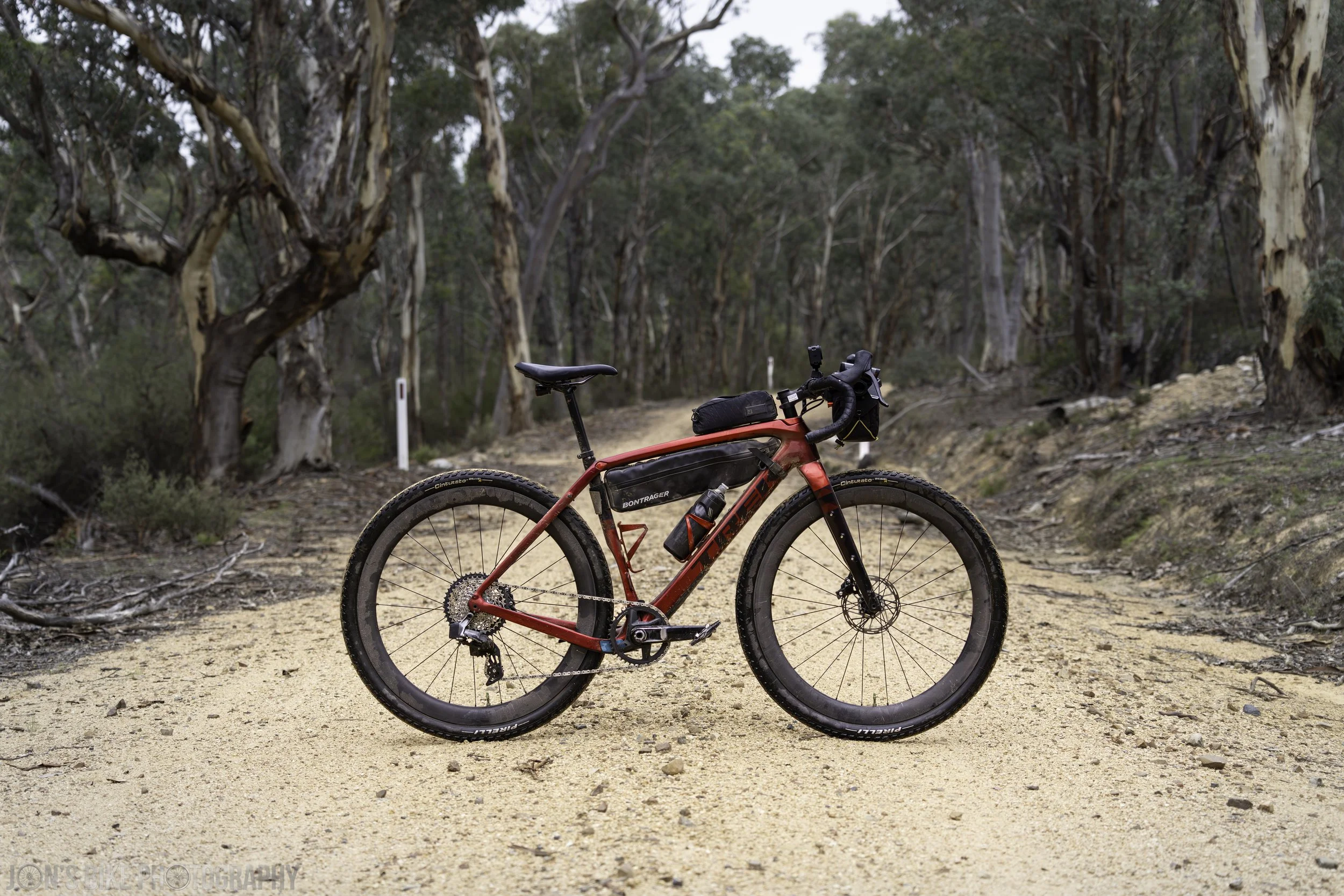 A Trek Checkpoint Gravel bike in the Brindabellas near Cotter Dam, on a dirt road.