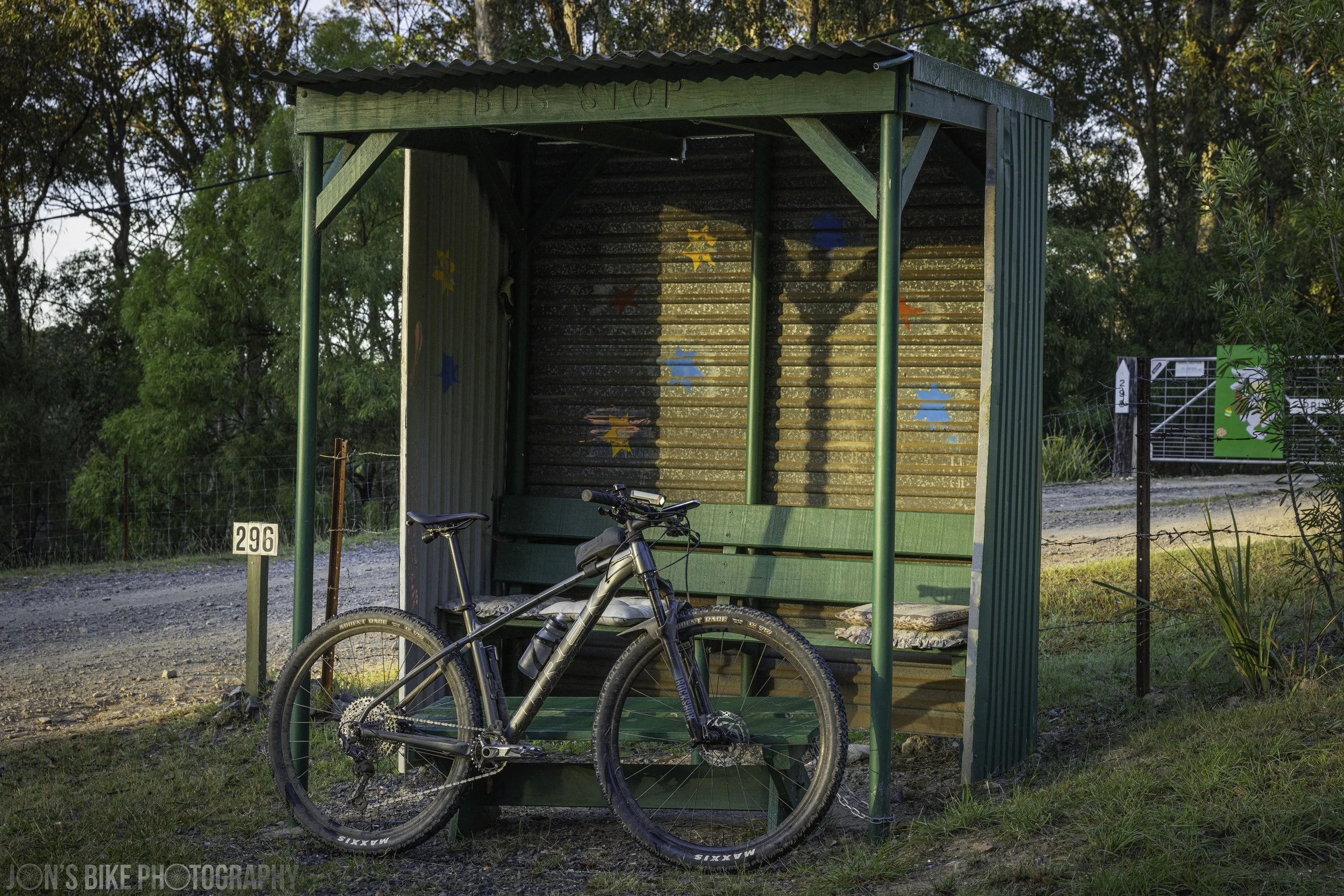 A Trek X-Caliber 8 in front of a green bus stop at Narooma, NSW.