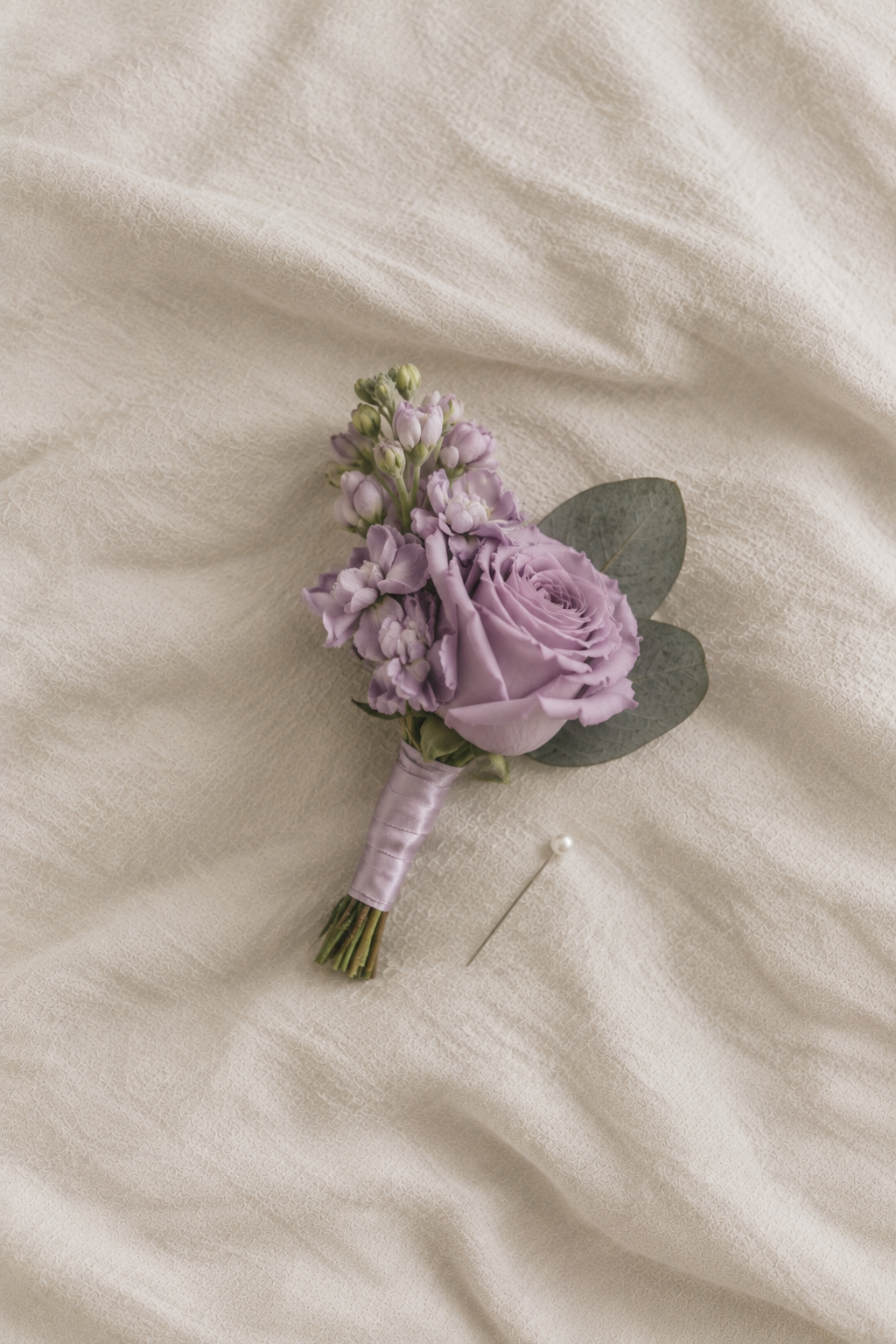 Lavender Boutonniere on Soft Linen.png