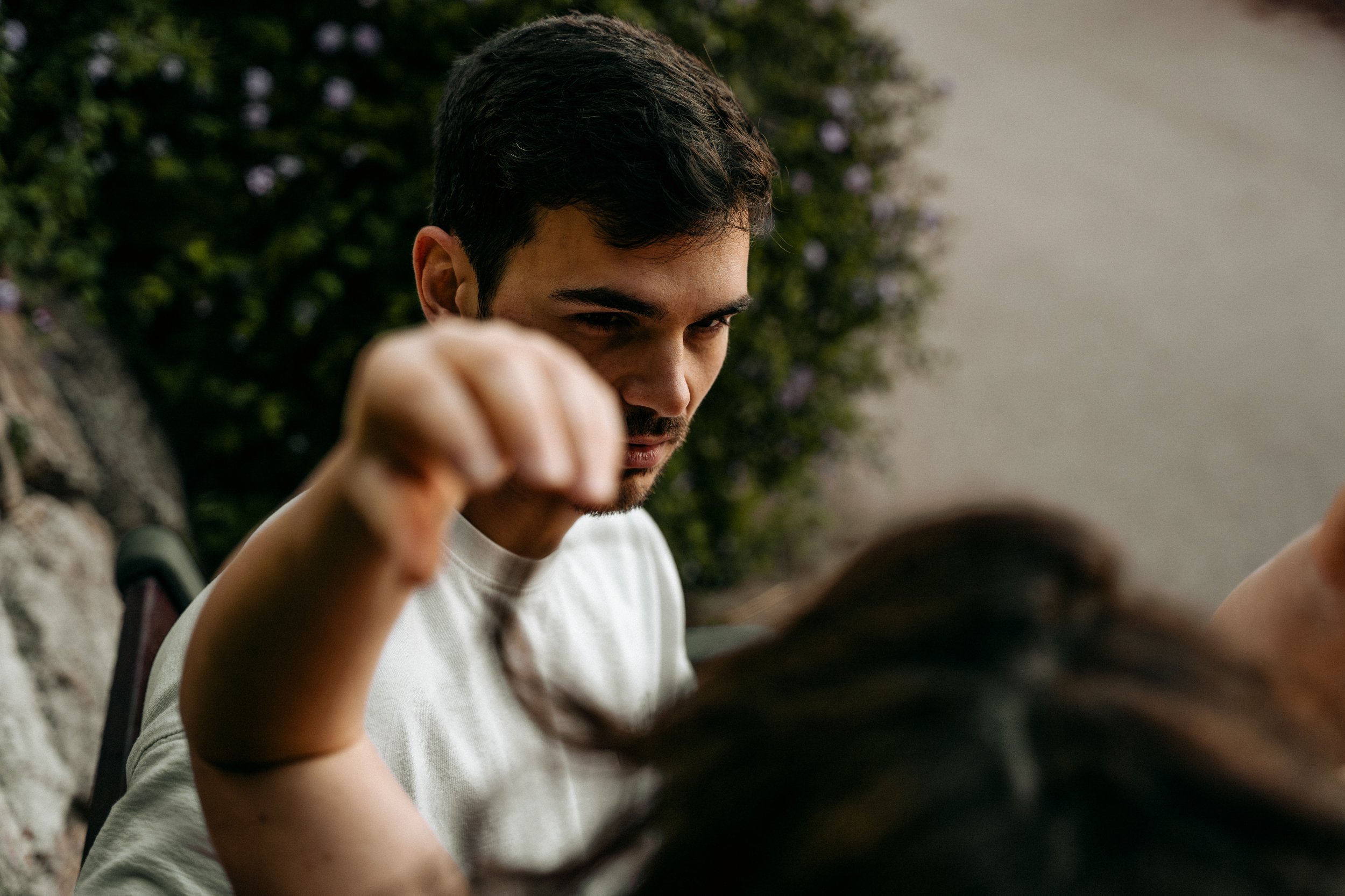 Individual portrait of a young man smiling outdoors in Barcelona — Whip & Honey photographer
