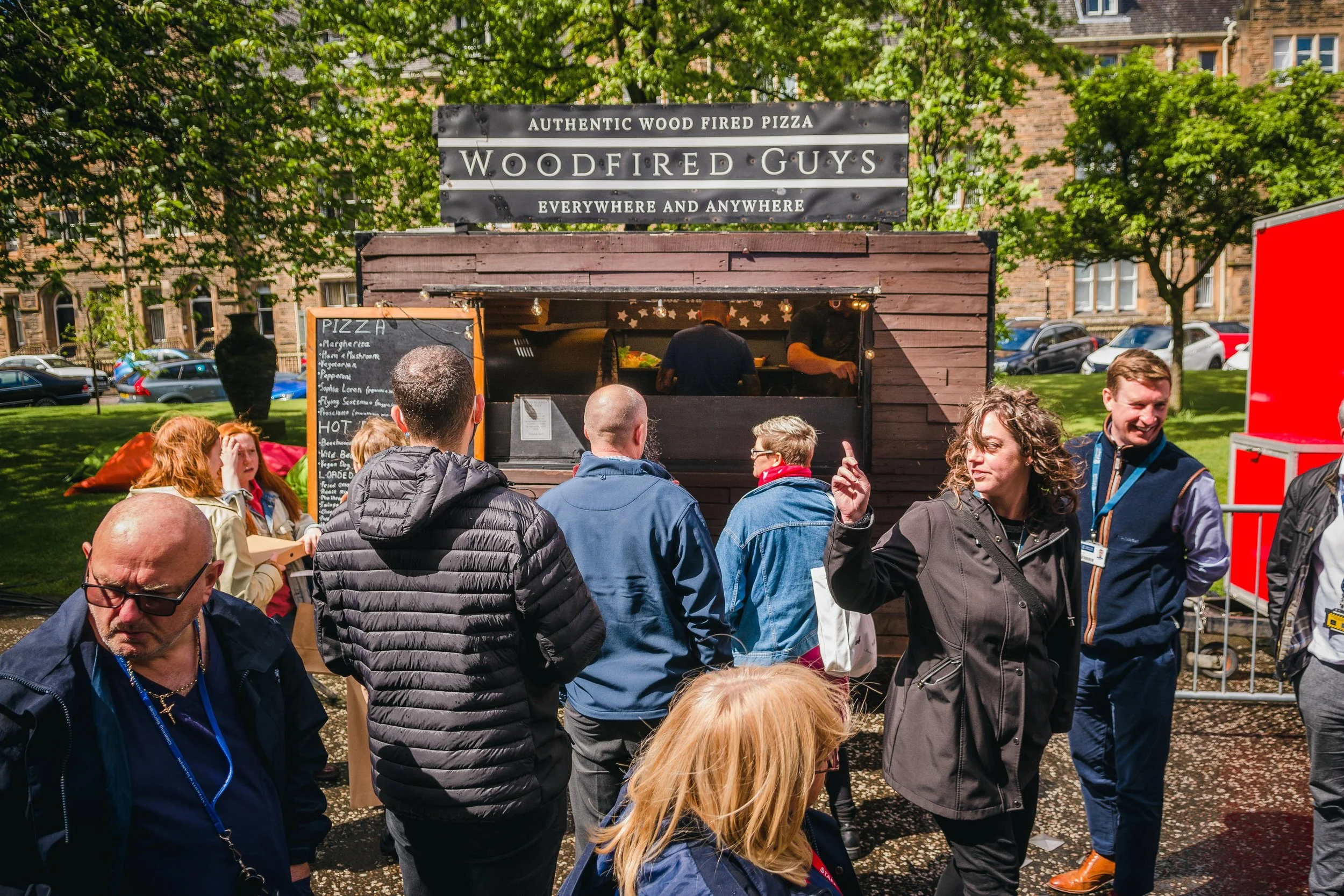 Corporate catering guests networking at an outdoor company event