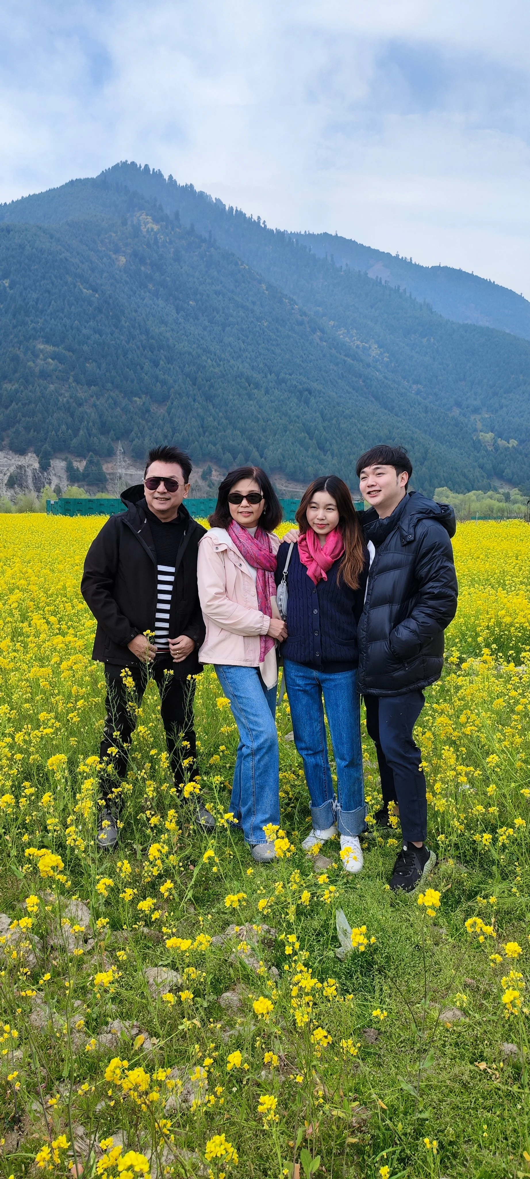 a group picture in mustard field in kashmir. it was on the way to Sonamarg.