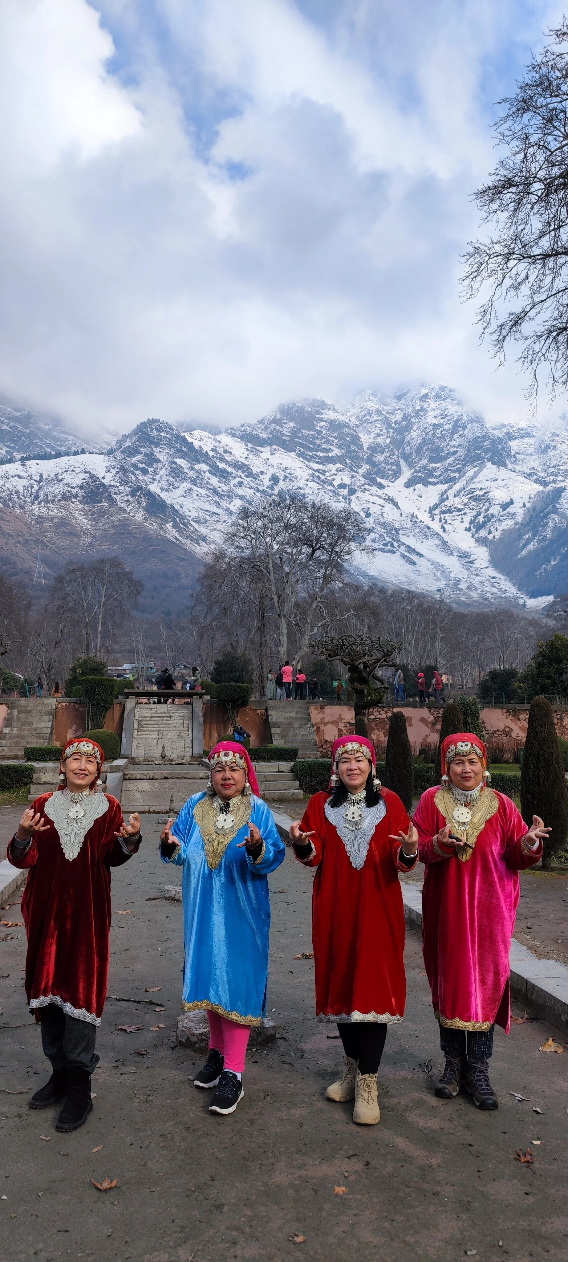 My group in Local kashmari dress in Nishat garden with the background of Zabarwan Hill in Srinagar city Kashmir