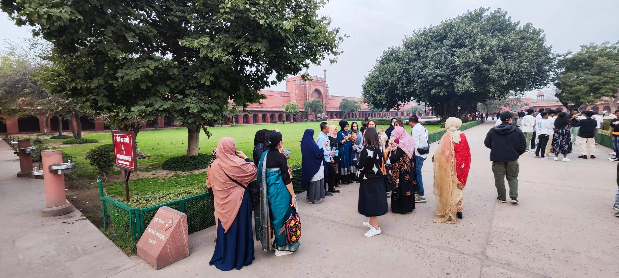 Waiting for the group to gather in Taj Mahal to go inside  together 