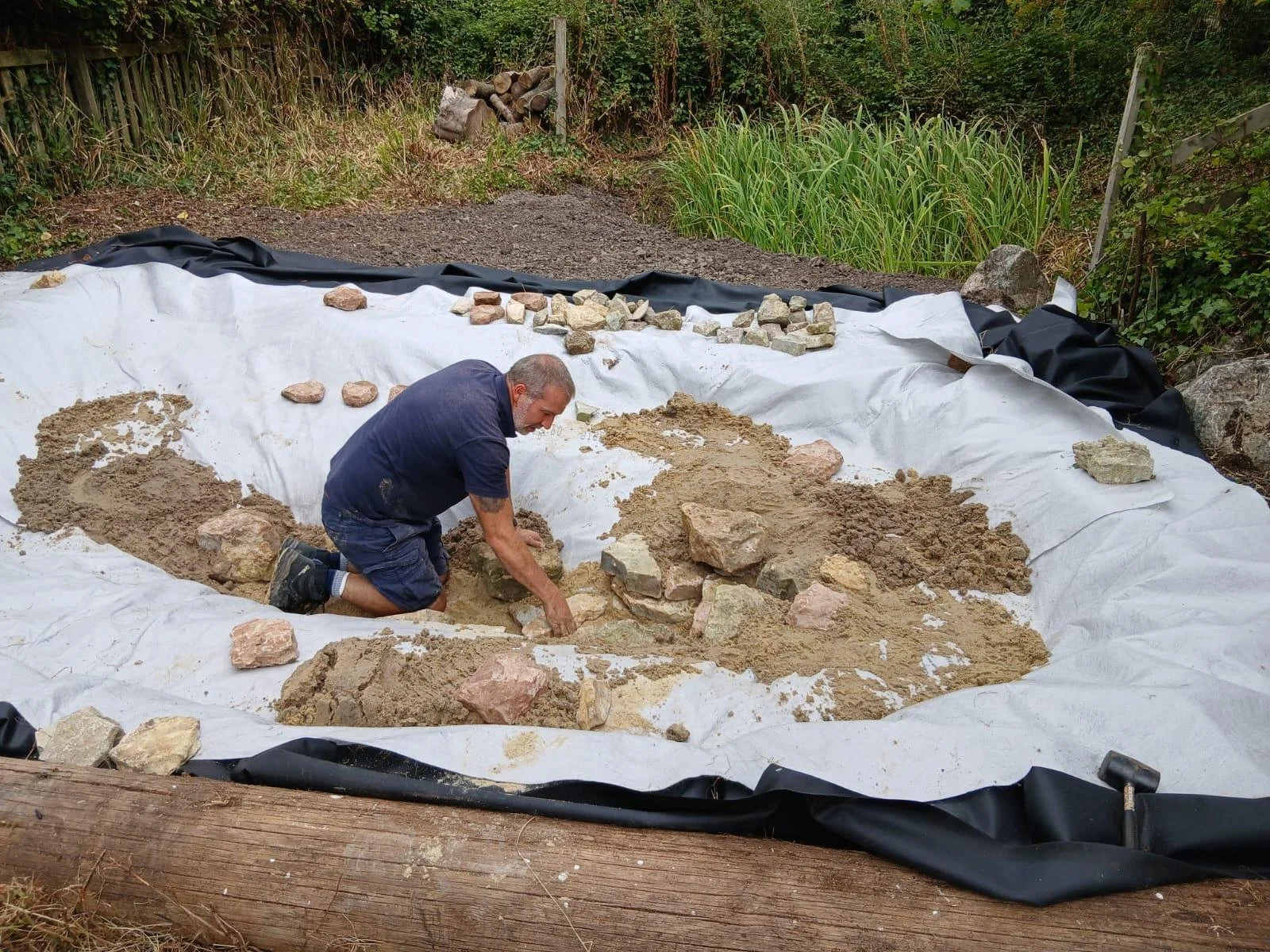 Tony Watt working on building a wildlife pond as part of a project in Somerset.