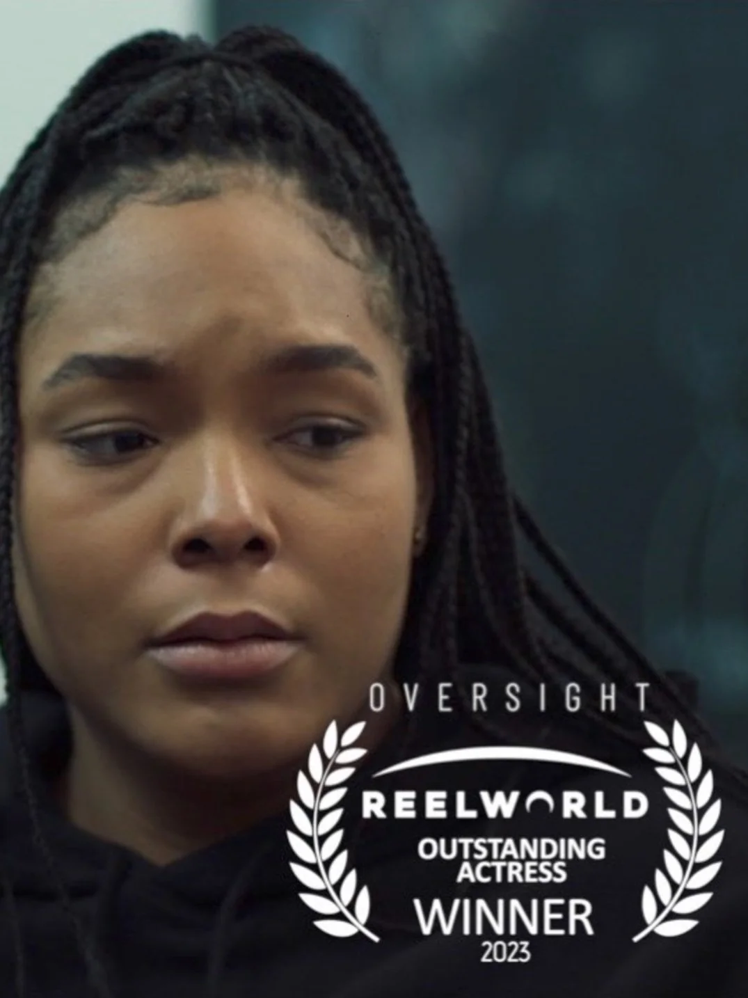 A person with braided hair looking serious, with overlay text showing an award for "ReelWorld Outstanding Actress Winner 2023" for "Oversight."