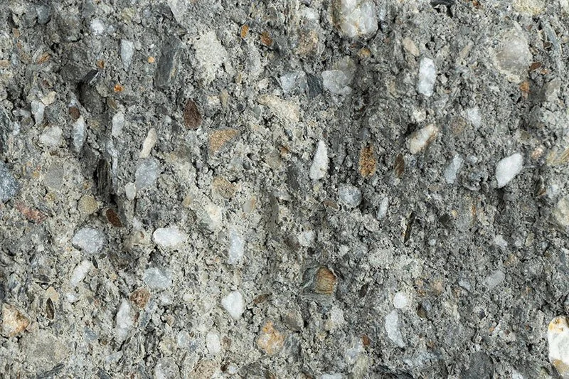 Close-up of dirt and gravel with small stones and pebbles.