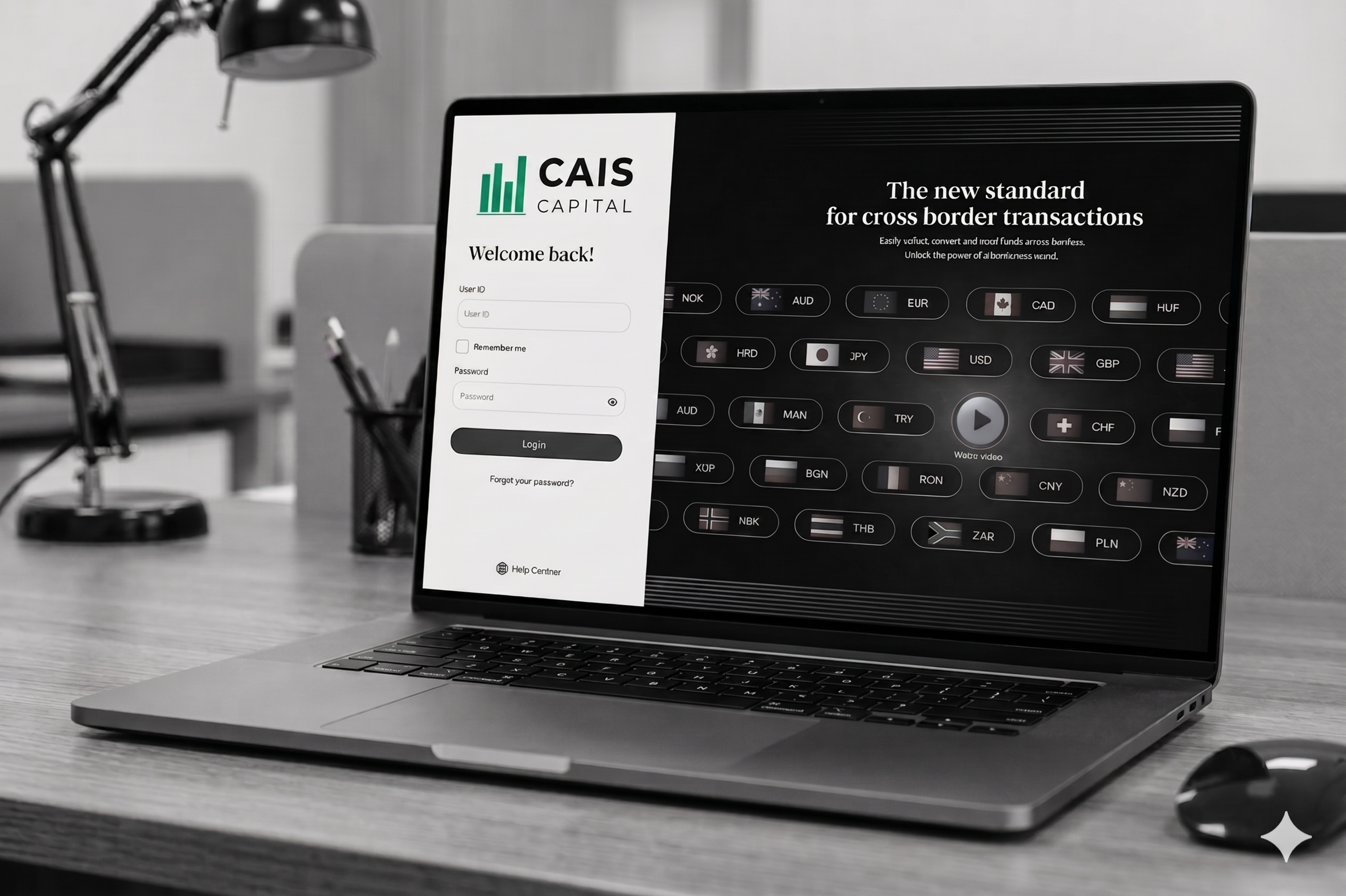 A laptop on a desk displaying a website for CAIS Capital with currency options and a login prompt, in an office setting with a black desk lamp and blurred office supplies in the background.