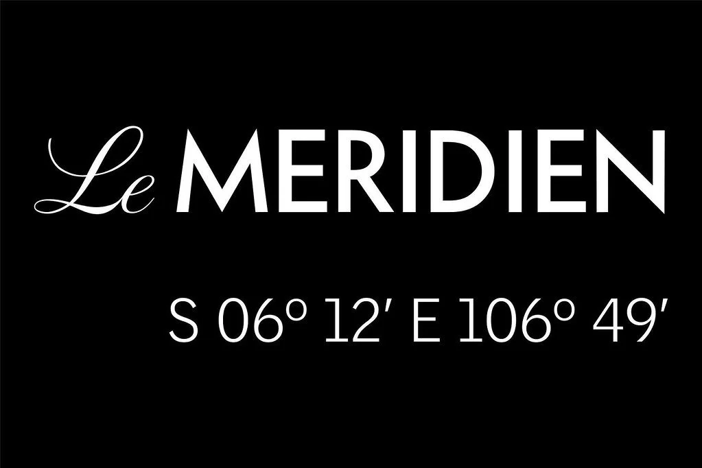 Black background with white text displaying 'Le MERIDIEN' and geographic coordinates 'S 06° 12' E 106° 49'.'