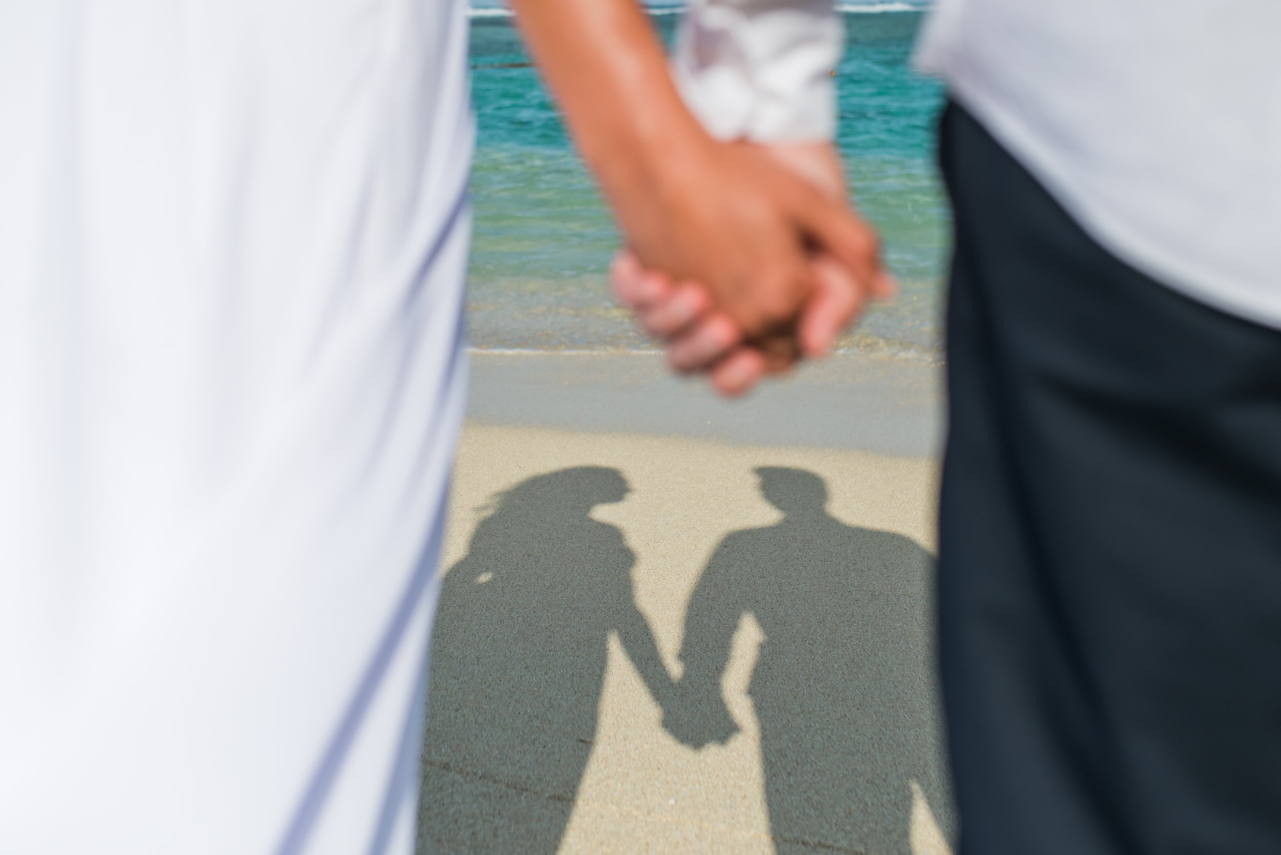 mauritius-beach-wedding-photographer-bride-groom-holding-hands.jpg