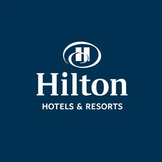 Hilton Hotels & Resorts logo on a dark blue background.