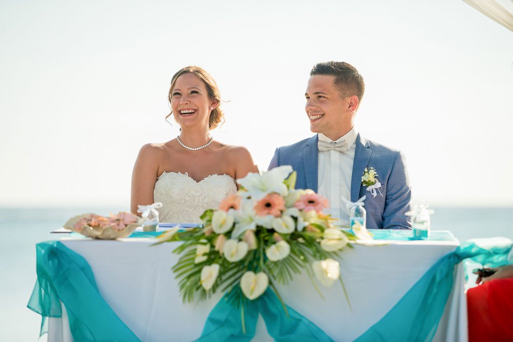 mauritius-beach-wedding-photographer-bride-groom-laugh-ceremony.jpeg