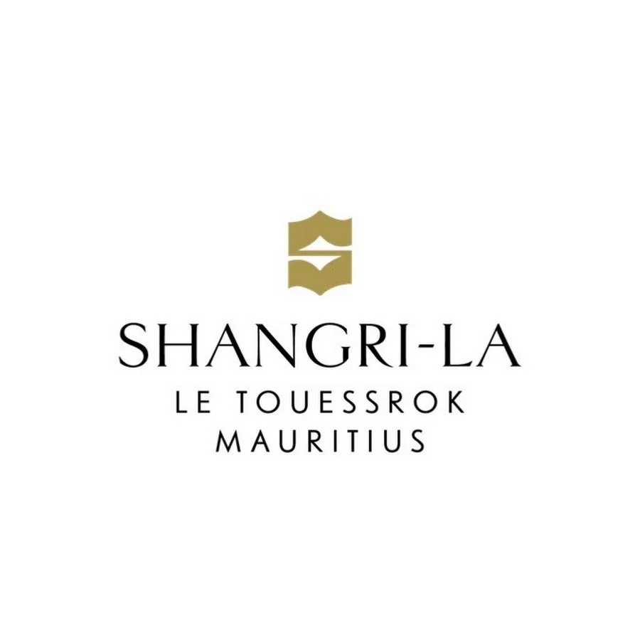 Logo featuring a stylized gold emblem and black text for 'Shangri-La Le Touessrok Mauritius' on a white background.