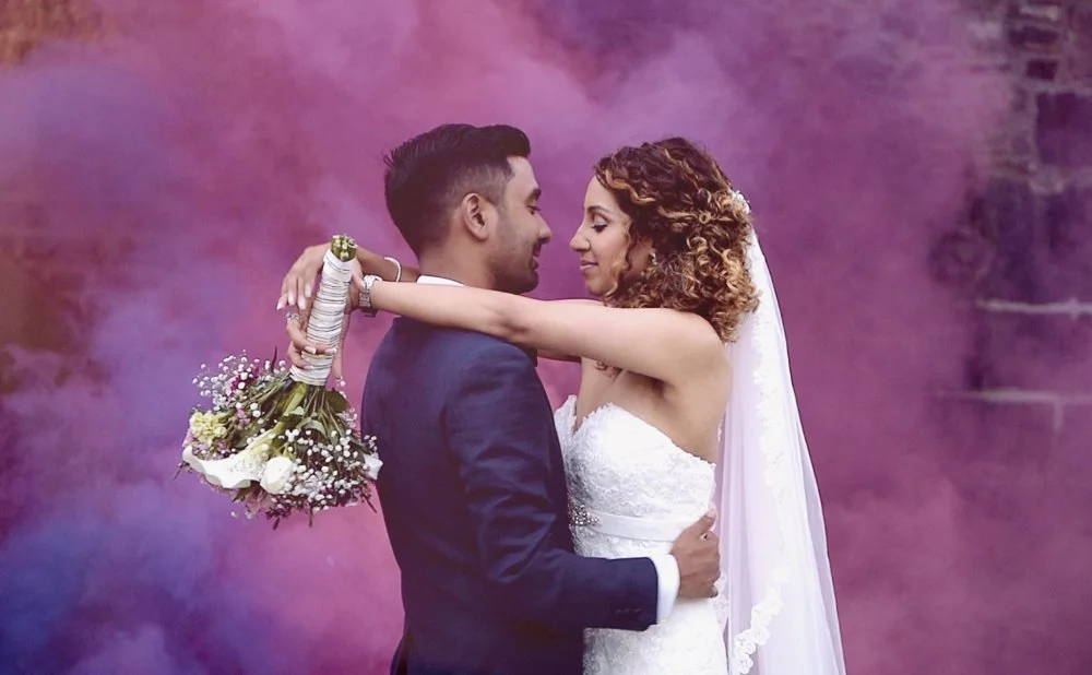 mauritius-beach-wedding-photographer-bride-groom-purple-smoke.jpeg