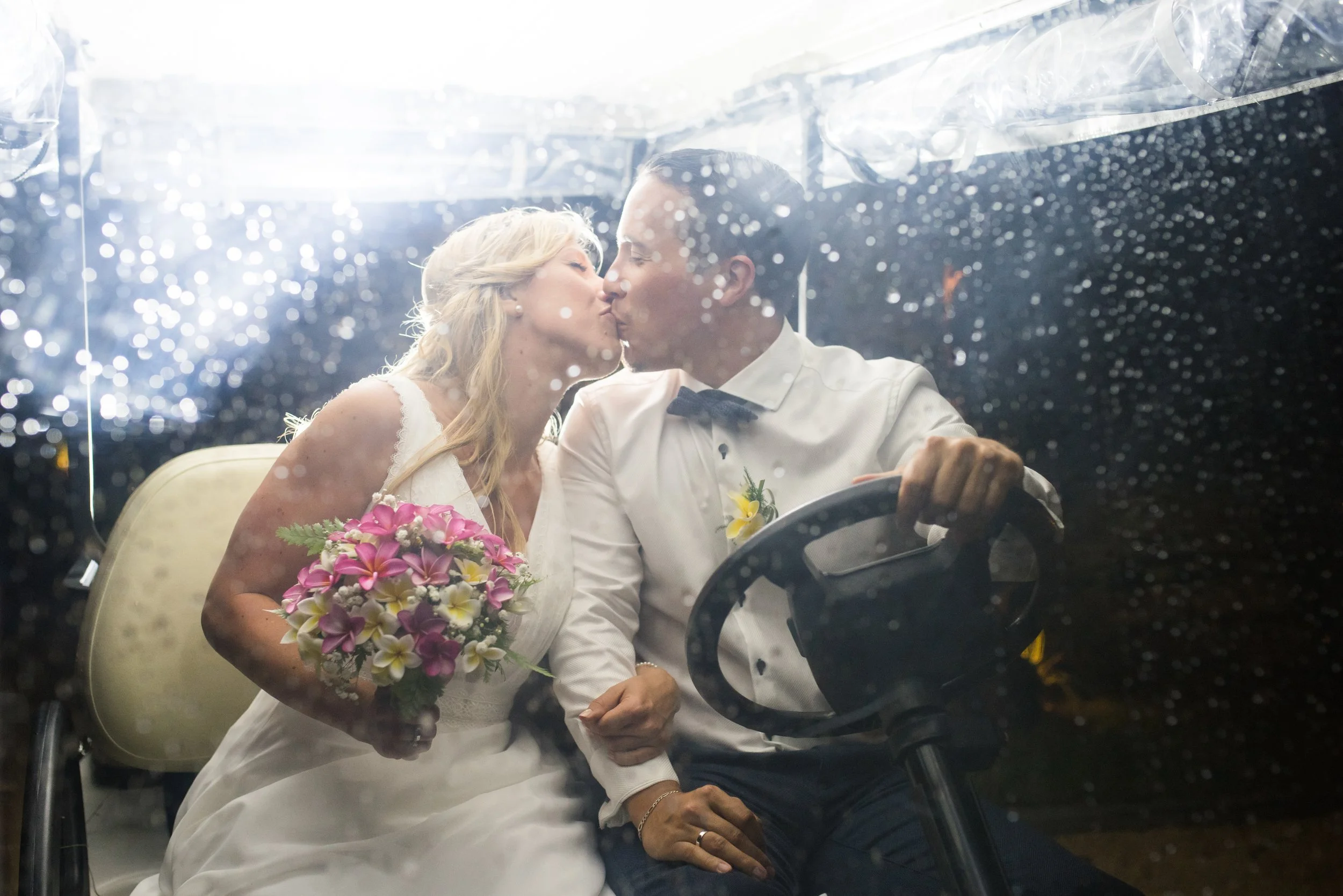 mauritius-beach-wedding-photographer-bride-groom-kiss-raindrops.jpg