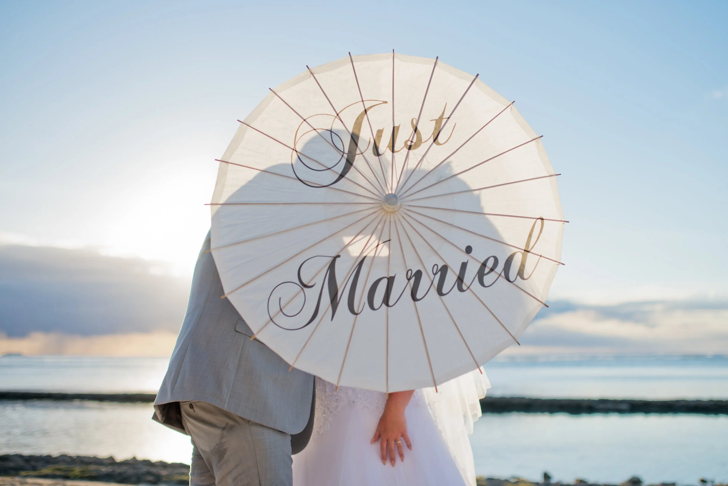 mauritius-beach-wedding-photographer-bride-groom-just-married-umbrella.jpg
