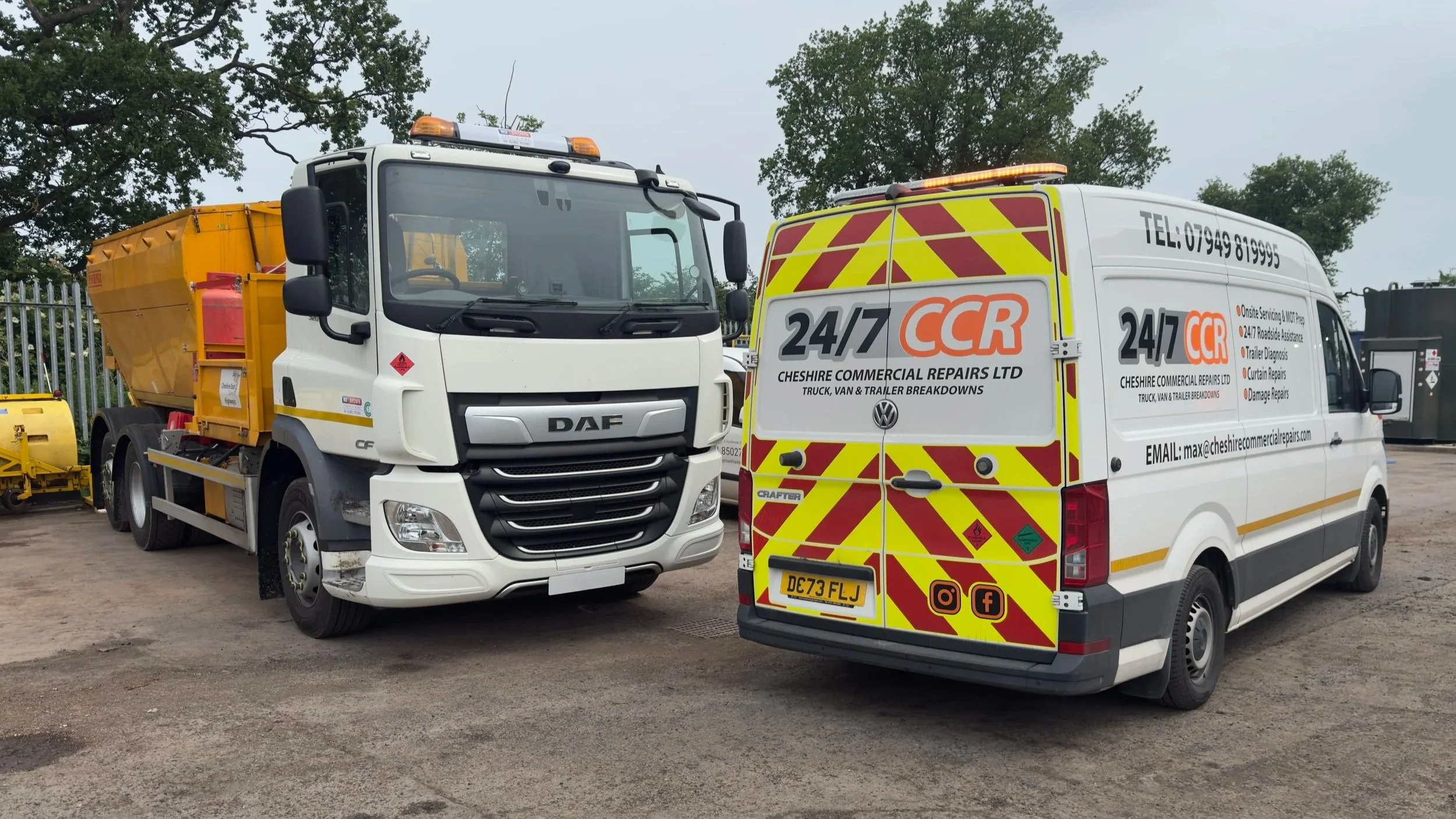 A white commercial truck and a white van with company branding are parked outdoors, with trees in the background. The van advertises 24/7 commercial repair services.